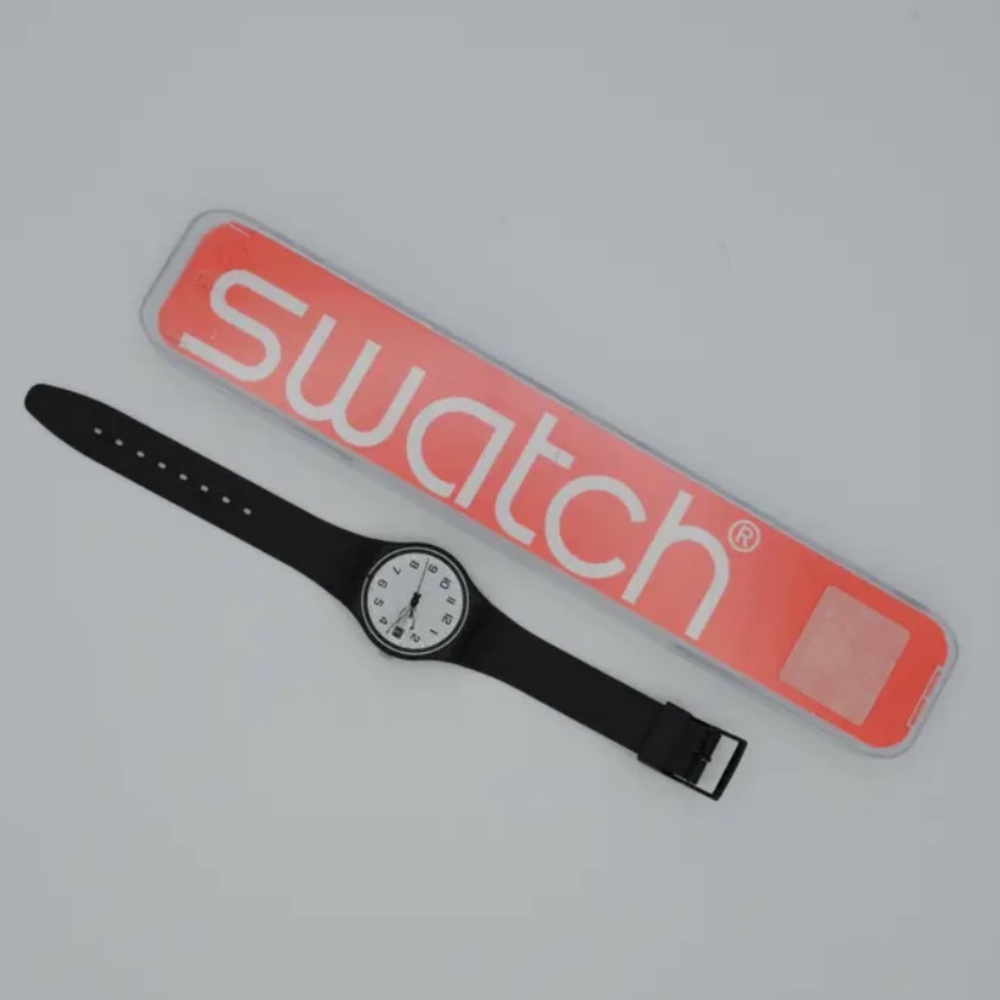 Swatch black watch with rubber band - water resistant - shock resistant